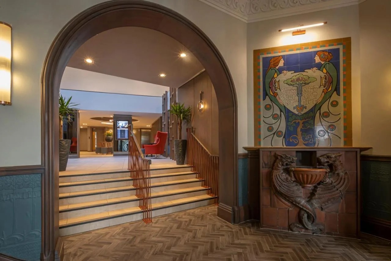 an entrance to a hallway with an archway and stairs at Clayton Hotel Bristol City in Bristol